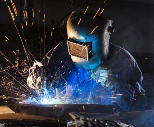 Why are more manufacturers switching to welding with fiber lasers from traditional welding techniques?